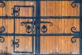 Close-up of wooden gate with wrought iron elements