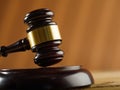 Close-up. Wooden gavel of the judge and in the background an open book on a dark beige background. Court and justice, Constitution Royalty Free Stock Photo