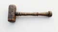 Close up of a wooden gavel resting on a white surface in a studio setting Royalty Free Stock Photo