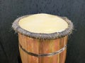 Close up of wooden handmade djembe drum on black background. Ethnic african percussion instrument with goat skin isolated. Music Royalty Free Stock Photo