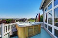 Close-up of wooden hot tub. Luxury house exterior.