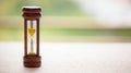 Close up wooden hourglass on table with motion blur background Royalty Free Stock Photo