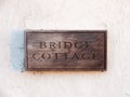 close up wooden house sign bridge cottage carved special unique