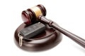 Close up of wooden judge gavel and car keys over soundboard Royalty Free Stock Photo