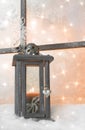 Close up of wooden lantern on window sill for a christmas greeting card