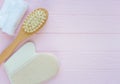 Close up wooden massage brushes for skin and body care on pink background. Beauty, spa and bath concept. Flat lay, Royalty Free Stock Photo