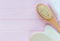 Close up wooden massage brushes for skin and body care on pink background. Beauty, spa and bath concept. Flat lay Royalty Free Stock Photo