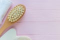 Close up wooden massage brushes for skin and body care on pink background. Beauty, spa and bath concept. Flat lay, top view. Royalty Free Stock Photo