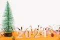 Close-up of wooden numbers 2021 on orange background with stars and cristmas tree . Change year 2020 to 2021