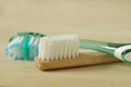 Close-up of wooden and plastic toothbrush - Concept of ecology and plastic pollution problem