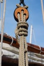 Close up of a wooden pulley with ropes of a classic sailing boat Royalty Free Stock Photo