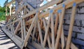 A close-up of a wooden roof truss components, webs, rafters, braces, struts ready for the roof framing during a house construction Royalty Free Stock Photo