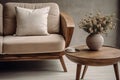 Close up of wooden round coffee table near beige fabric mid-century armchair. Scandinavian style home interior design