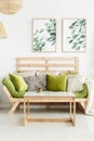 Wooden sofa with green cushions Royalty Free Stock Photo