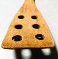 Wooden spatula with holes Royalty Free Stock Photo