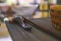 Close-up of wooden spoon and chopsticks next to a rattan rice bowl, inside is a traditional Vietnamese lunch, rice, soup, salty Royalty Free Stock Photo