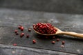 Pink peppercorn in wooden spoon studio shot Royalty Free Stock Photo