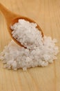 close up of a wooden spoon of a white salt Royalty Free Stock Photo