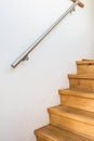 Close up of wooden stairs and railing in a home, details of a modern house Royalty Free Stock Photo