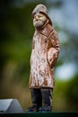 Close up of a wooden statue of a fisherman