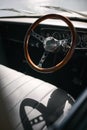 Close Up Of Wooden Steering Wheel And Leather Seat In Vintage Car