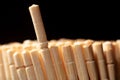 Close up of wooden toothpicks on a black background. Royalty Free Stock Photo