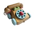 Close up of wooden toy telephone with coloured dials and wheels isolated on white background Royalty Free Stock Photo