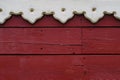 Close Up of wooden wall with part of wooden carved window frame