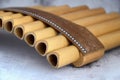 Close-up of woodwind instrument pan flute. Details of musical instruments, music Royalty Free Stock Photo