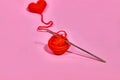 Close up of a wool ball and heart shape on color background. Heart shaped woolen yarn. Love Crochet. Royalty Free Stock Photo