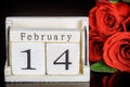 Close up of word february and number 14 with bouquet of beautiful red roses Royalty Free Stock Photo