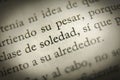 Close up of word loneliness solitude word in spanish novel page