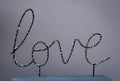 Close-up, the word love on a colored background.