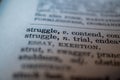 Close up of word struggle in dictionary Royalty Free Stock Photo