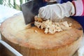 Close up the work of the chef in the kitchen Woman& x27;s hands are slicing chicken meat on a wooden cutting board. Royalty Free Stock Photo