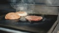 Close up. Worker Cooking Burger in Food Truck.