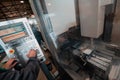 close up a worker hand or engineer introducing a program into a modern CNC machine. The concept of industry and