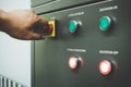 Close up of Worker hand turn on the main power before operating Royalty Free Stock Photo