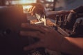 Close-up Worker handles metal at lathe Turner measures the dimensions of the metal workpiece with a caliper in uniform with safety