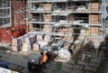 Close up of worker on his back materials and scaffolding on construction site. Nottingham, England 17 February 2020.