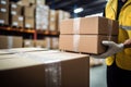 close up a worker moving Package Boxes on Pallet in Warehouse, hands visible. AI Generated