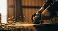 Close-up of a worker\'s hands using an angle grinder, creating a shower of sparks. Royalty Free Stock Photo
