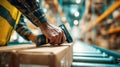 Close-up of Worker Scanning Box in Warehouse with Barcode Scanner Royalty Free Stock Photo