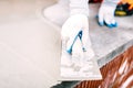 Close-up of worker steel trowel and hand, using plastering tools Royalty Free Stock Photo