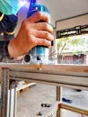 Close up worker using electric wood router making beauty pattern on wood part of furniture hand made Royalty Free Stock Photo