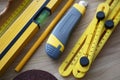 Workers set of instruments, box cutter, level, ruler equipment on wooden table Royalty Free Stock Photo