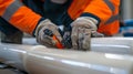 Close-up of workers using wrench on pipeline in industrial setting. Concept of industrial maintenance, teamwork, and Royalty Free Stock Photo