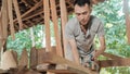 Close up of workers working using electric wooden dowels while grinding wood