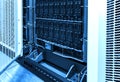 Close up on working data servers hard drive disk storage blue toning