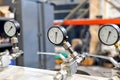 Close-up of a working pressure gauge of a hydraulic oil station in a workshop